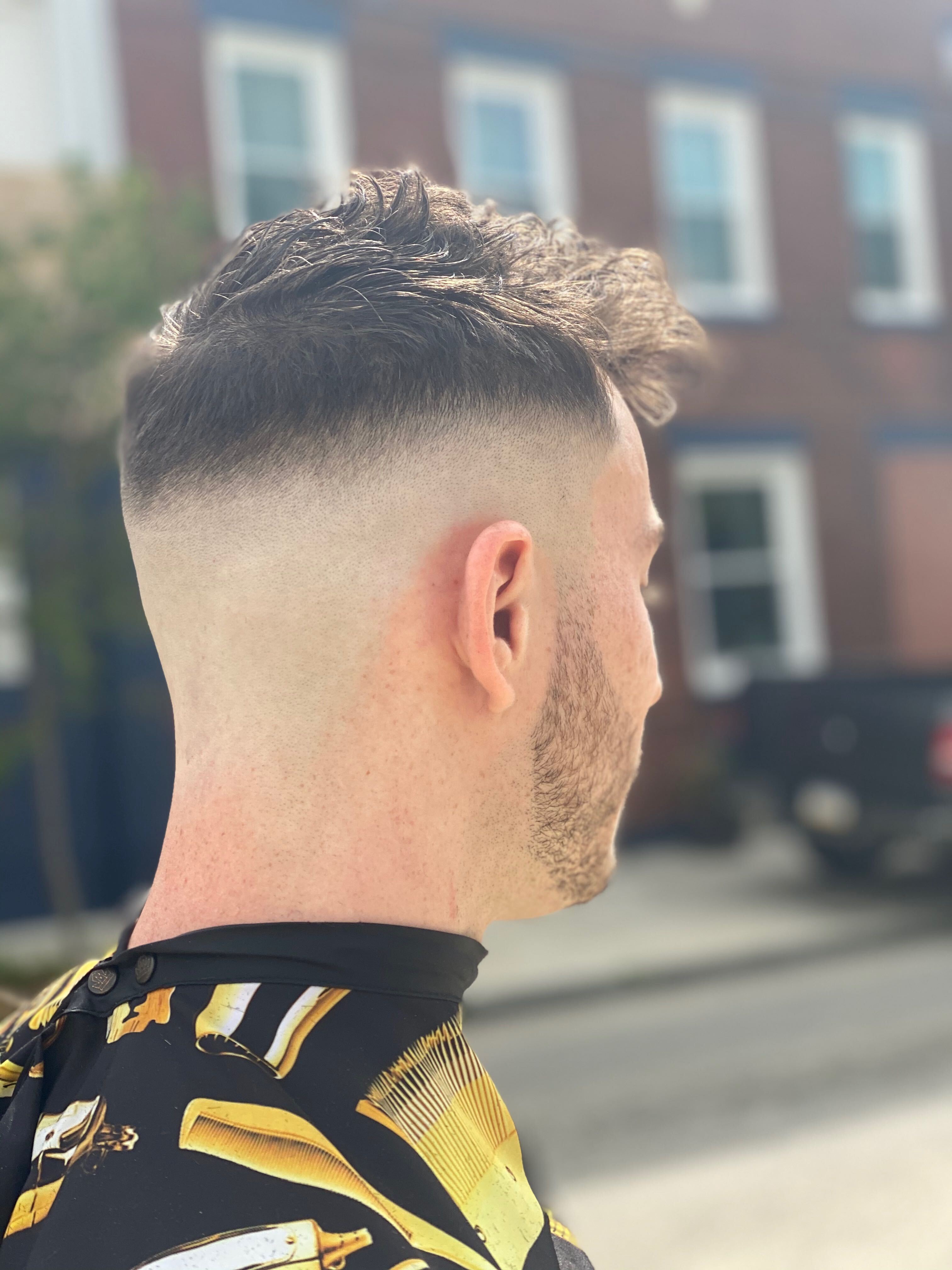 High fade and textured haircut by The Barber Shock